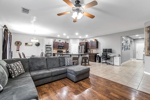 976 Daisy Ct, Dinuba, CA 93618 - living area with ceiling fan, an office area, recessed lighting, and light tile patterned floors