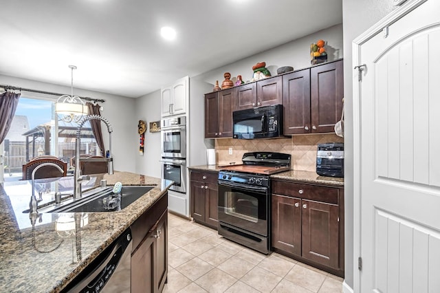 976 Daisy Ct, Dinuba, CA 93618 - kitchen featuring black appliances, decorative backsplash, dark brown cabinetry, and light tile patterned flooring