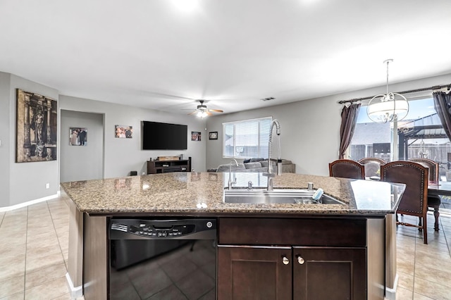 976 Daisy Ct, Dinuba, CA 93618 - kitchen with dishwasher, a ceiling fan, dark brown cabinets, light tile patterned floors, and an island with sink