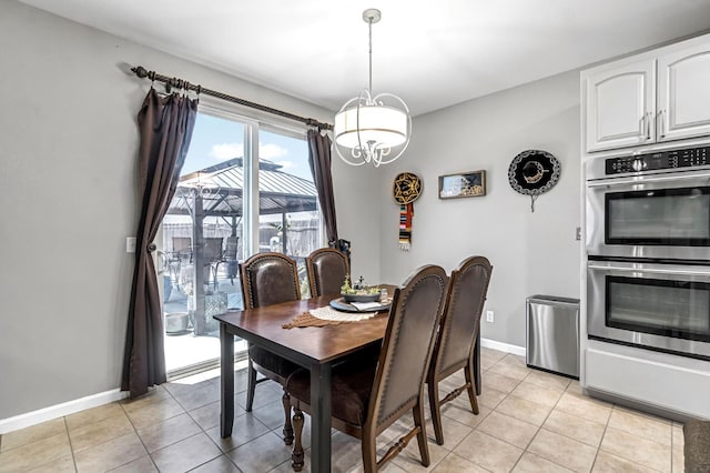 976 Daisy Ct, Dinuba, CA 93618 - dining area featuring a chandelier and light tile patterned flooring