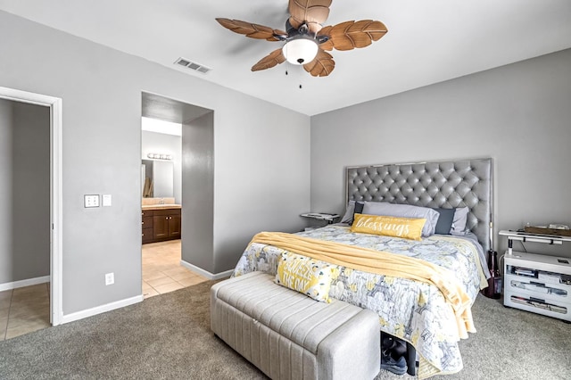 976 Daisy Ct, Dinuba, CA 93618 - tiled bedroom featuring carpet, ceiling fan, and ensuite bathroom