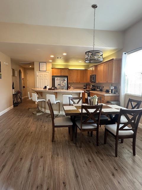 2400 Garda Corte, Chowchilla, CA 93610 - dining area with dark wood finished floors, recessed lighting, and arched walkways