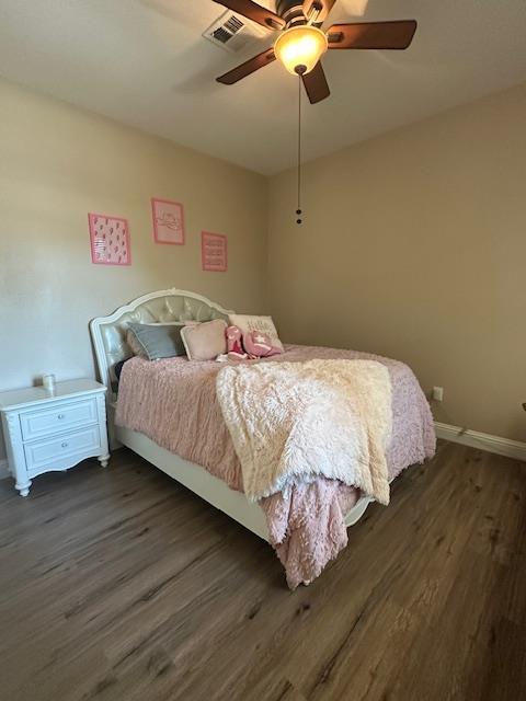 2400 Garda Corte, Chowchilla, CA 93610 - bedroom featuring dark wood-style floors and a ceiling fan