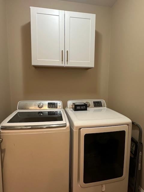 2400 Garda Corte, Chowchilla, CA 93610 - laundry area featuring cabinet space and washing machine and clothes dryer