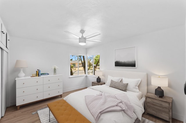 644 W Yale Ave, Fresno, CA 93705 - bedroom with light wood-style floors, a closet, and ceiling fan