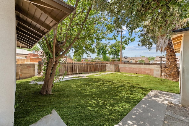 644 W Yale Ave, Fresno, CA 93705 - fenced backyard with a patio area