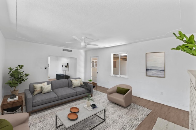 644 W Yale Ave, Fresno, CA 93705 - living area with wood finished floors, a ceiling fan, and a textured ceiling