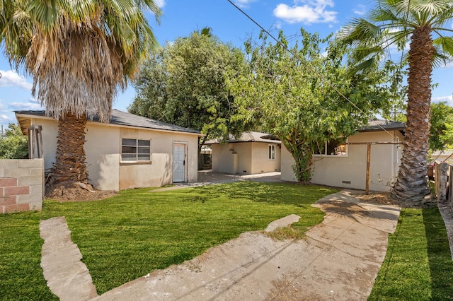 644 W Yale Ave, Fresno, CA 93705 - rear view of property featuring stucco siding