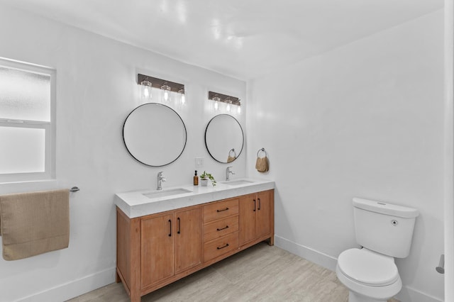 644 W Yale Ave, Fresno, CA 93705 - bathroom with double vanity and baseboards