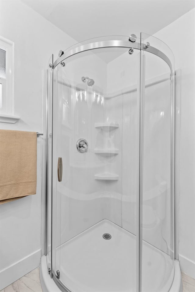 644 W Yale Ave, Fresno, CA 93705 - bathroom with a stall shower and marble look tiles