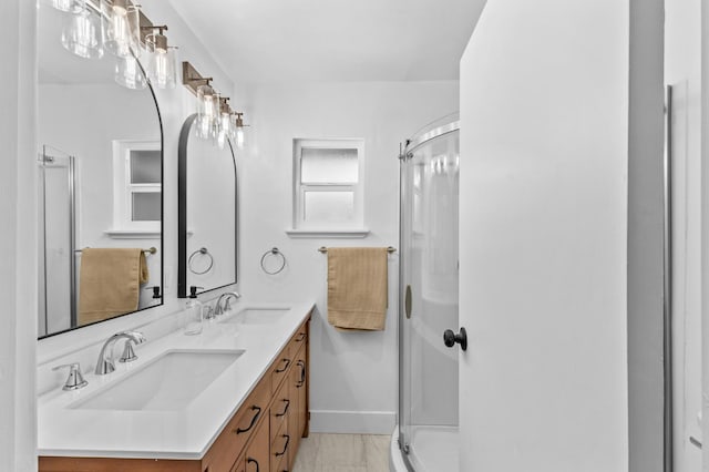 644 W Yale Ave, Fresno, CA 93705 - bathroom with double vanity, a shower stall, and marble look tile flooring