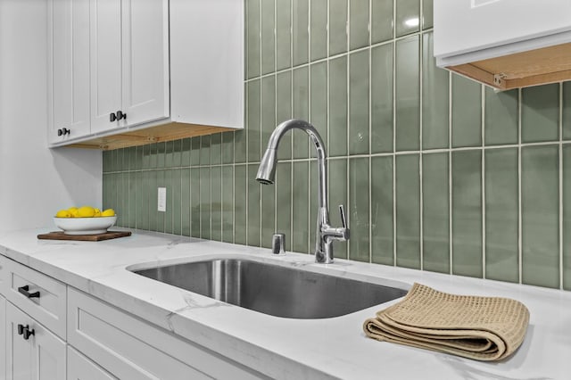 644 W Yale Ave, Fresno, CA 93705 - kitchen featuring white cabinetry, tasteful backsplash, and light stone countertops