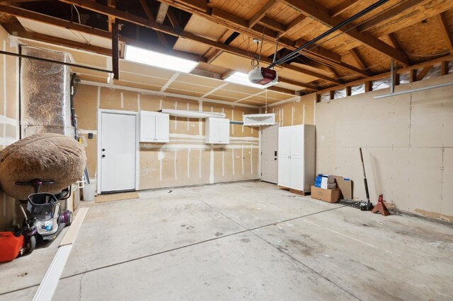 2261 Magill Ave, Clovis, CA 93611 - garage featuring a garage door opener