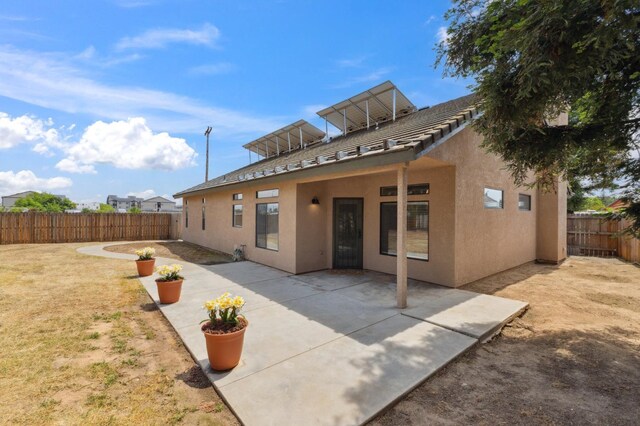 2261 Magill Ave, Clovis, CA 93611 - rear view of house with a fenced backyard, stucco siding, and a patio