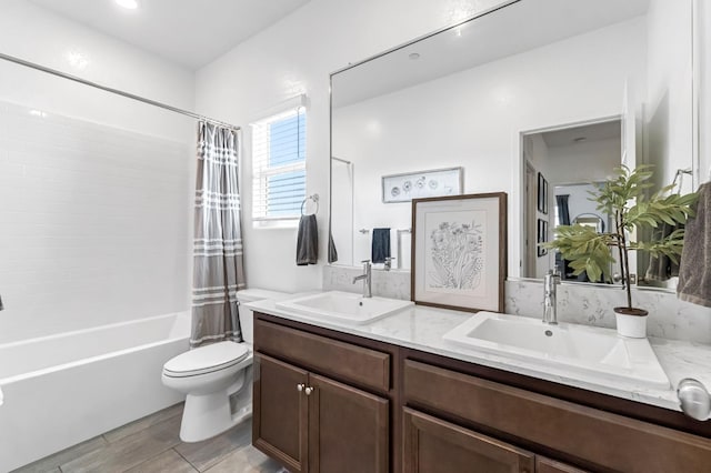 827 Vintage Ave, Clovis, CA 93619 - bathroom featuring double vanity, shower / tub combo, and wood finished floors