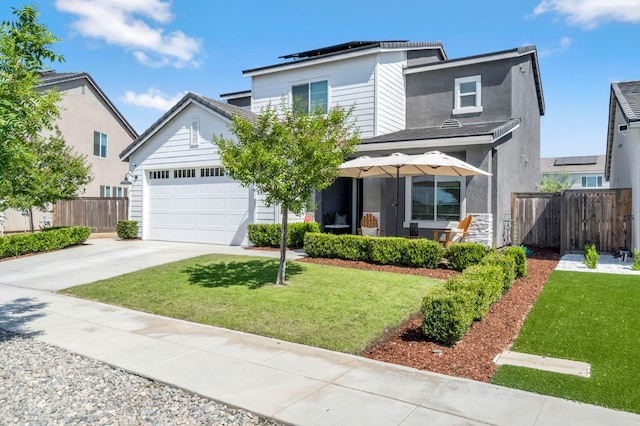 827 Vintage Ave, Clovis, CA 93619 - traditional-style house with concrete driveway, an attached garage, and solar panels
