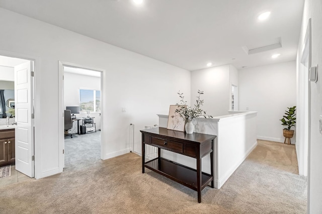 827 Vintage Ave, Clovis, CA 93619 - hallway featuring light carpet, attic access, a desk, and recessed lighting