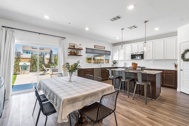 827 Vintage Ave, Clovis, CA 93619 - dining area with light wood finished floors and recessed lighting