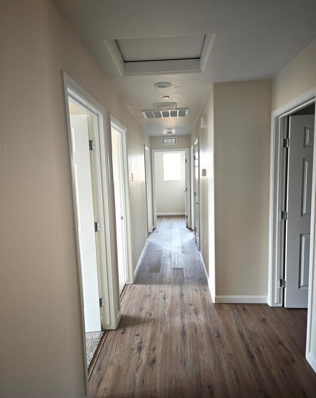 66 E Geary Ave, Fresno, CA 93706 - corridor with wood finished floors and attic access