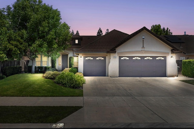 2549 Whiteash Ave, Clovis, CA 93619 - view of front of property featuring an attached garage, concrete driveway, stucco siding, and a tile roof