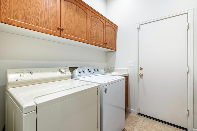 2549 Whiteash Ave, Clovis, CA 93619 - laundry room with washer and dryer, cabinet space, and light tile patterned floors