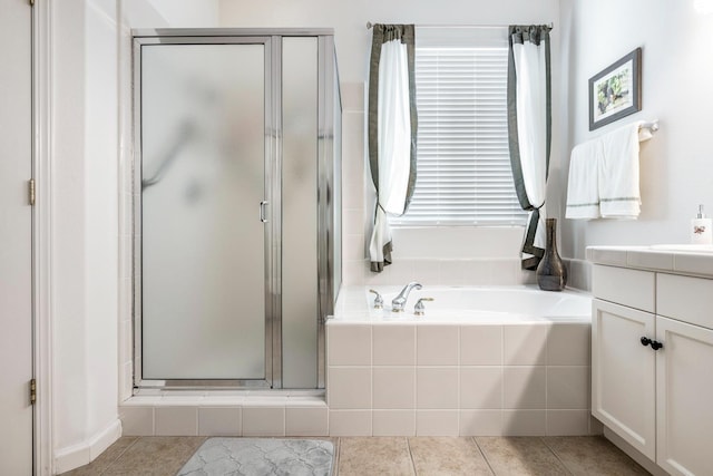 2549 Whiteash Ave, Clovis, CA 93619 - bathroom featuring a shower stall, vanity, a garden tub, and tile patterned floors