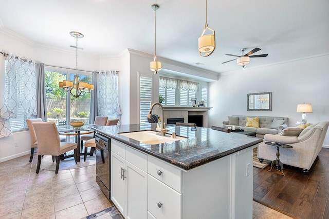 2549 Whiteash Ave, Clovis, CA 93619 - kitchen featuring a chandelier, healthy amount of natural light, dishwasher, white cabinets, and ornamental molding