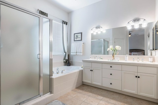 2549 Whiteash Ave, Clovis, CA 93619 - ensuite bathroom with a stall shower, double vanity, a bath, tile patterned flooring, and a ceiling fan