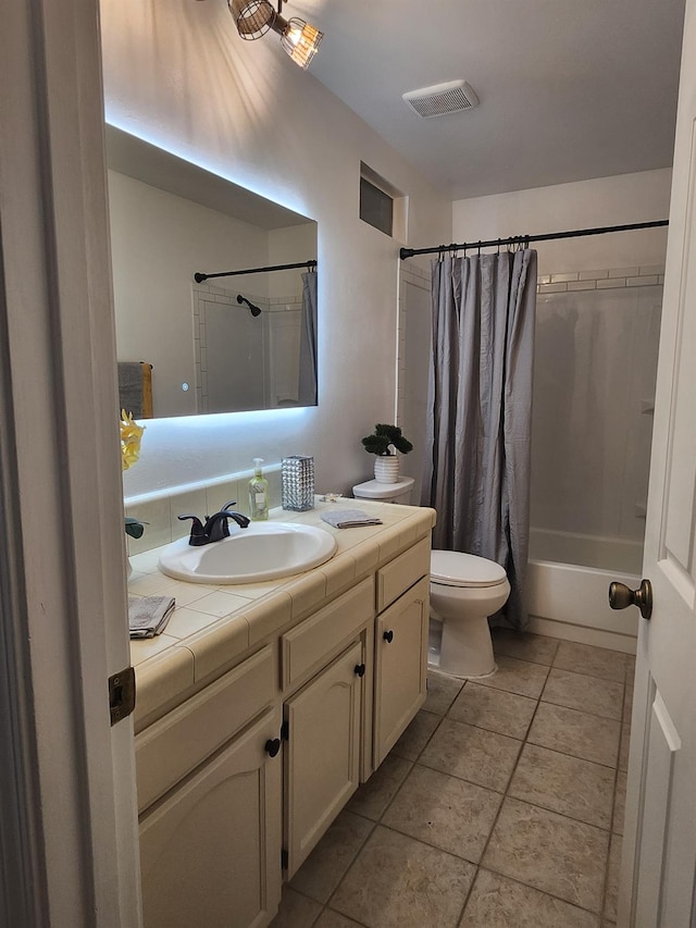 6536 N Tracy Ave, Fresno, CA 93722 - bathroom with vanity, shower / bathtub combination with curtain, and tile patterned flooring