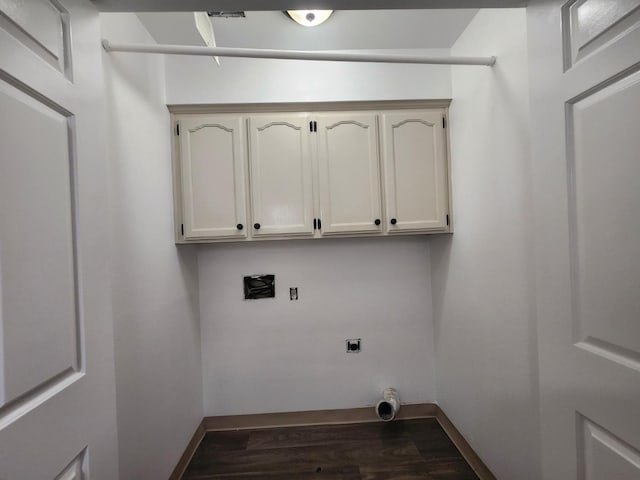 6536 N Tracy Ave, Fresno, CA 93722 - washroom with hookup for an electric dryer, dark wood-style floors, and cabinet space
