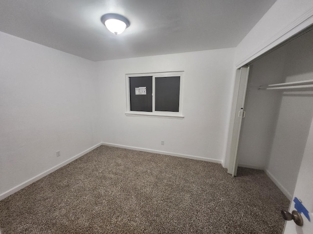 6536 N Tracy Ave, Fresno, CA 93722 - unfurnished bedroom with carpet floors and a closet