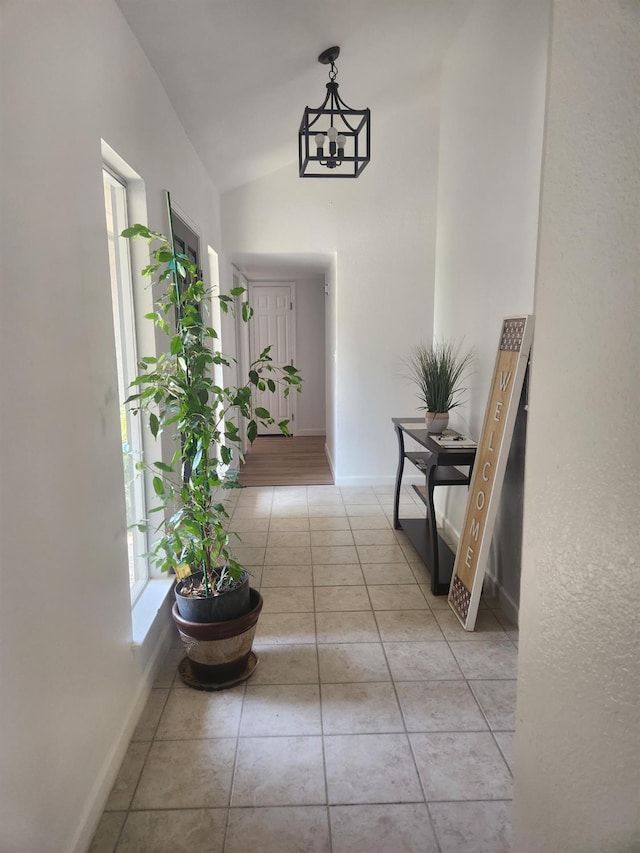 6536 N Tracy Ave, Fresno, CA 93722 - hall with plenty of natural light, light tile patterned flooring, and vaulted ceiling