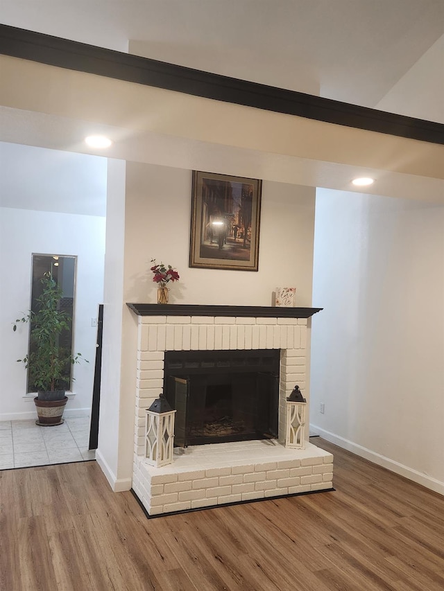 6536 N Tracy Ave, Fresno, CA 93722 - detailed view of wood finished floors, a fireplace, and recessed lighting