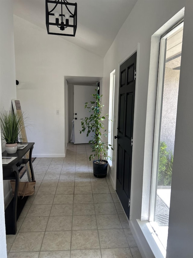 6536 N Tracy Ave, Fresno, CA 93722 - corridor featuring vaulted ceiling, healthy amount of natural light, and light tile patterned floors