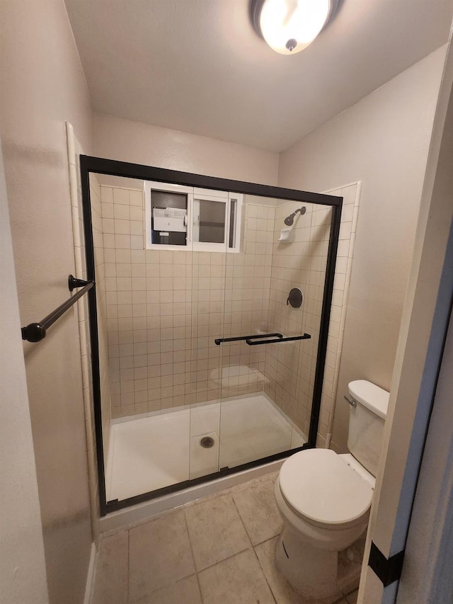 6536 N Tracy Ave, Fresno, CA 93722 - full bathroom with a shower stall and tile patterned flooring