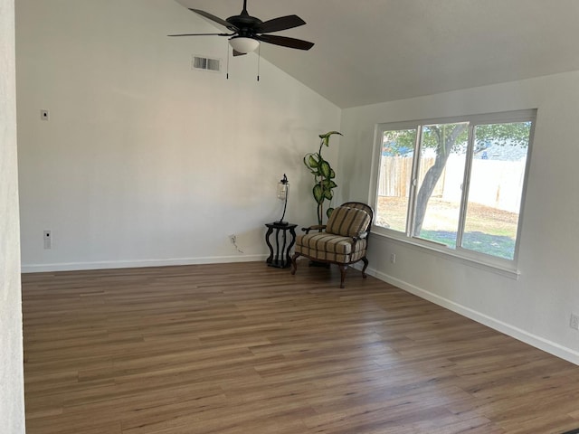 6536 N Tracy Ave, Fresno, CA 93722 - unfurnished room with ceiling fan, wood finished floors, and high vaulted ceiling