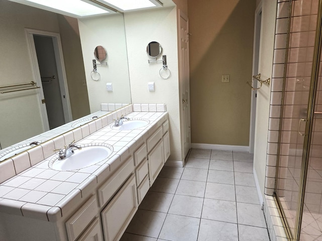 1229 W Bullard Ave Unit 105, Fresno, CA 93711 - bathroom featuring double vanity, tile patterned flooring, and a tile shower