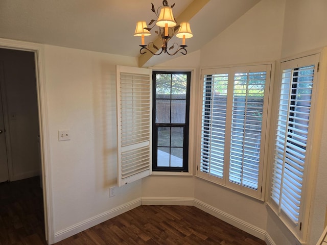 1229 W Bullard Ave Unit 105, Fresno, CA 93711 - unfurnished dining area with dark wood-style floors, lofted ceiling, and a chandelier