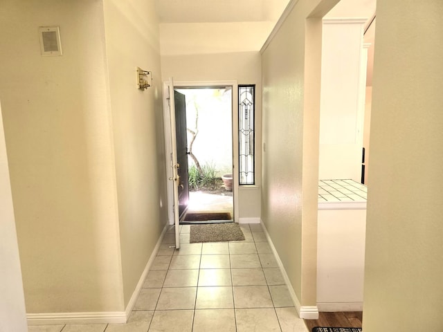 1229 W Bullard Ave Unit 105, Fresno, CA 93711 - doorway to outside featuring baseboards and light tile patterned floors