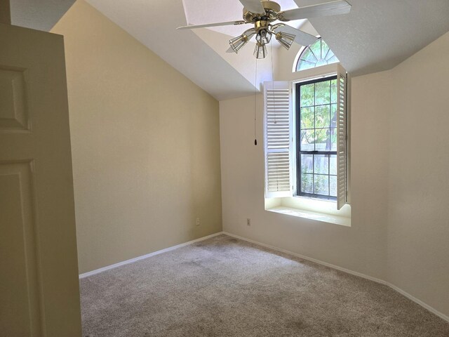 1229 W Bullard Ave Unit 105, Fresno, CA 93711 - carpeted empty room with vaulted ceiling and a ceiling fan