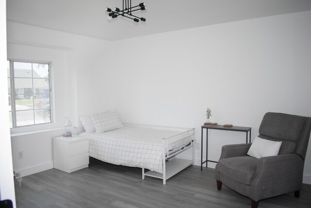 19244 W Casmalia, Rialto, CA 92377 - bedroom featuring multiple windows, wood finished floors, and a chandelier