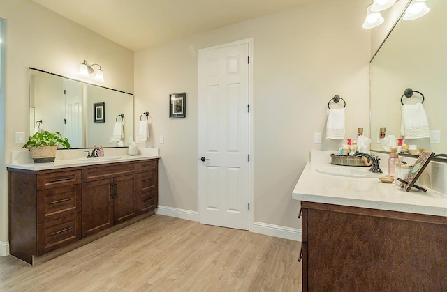2047 Menlo Ave, Clovis, CA 93611 - bathroom featuring wood finished floors and two vanities