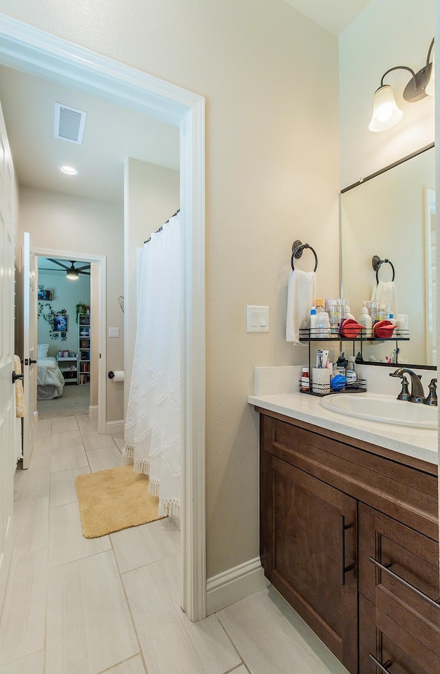 2047 Menlo Ave, Clovis, CA 93611 - ensuite bathroom featuring vanity, ceiling fan, and tile patterned floors