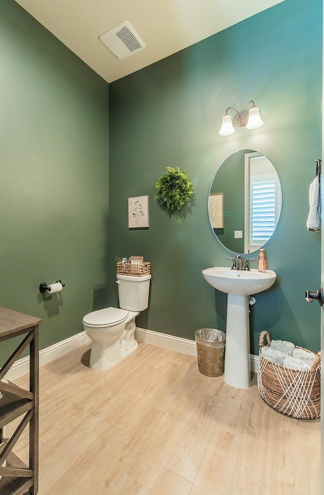 2047 Menlo Ave, Clovis, CA 93611 - half bathroom featuring wood finished floors