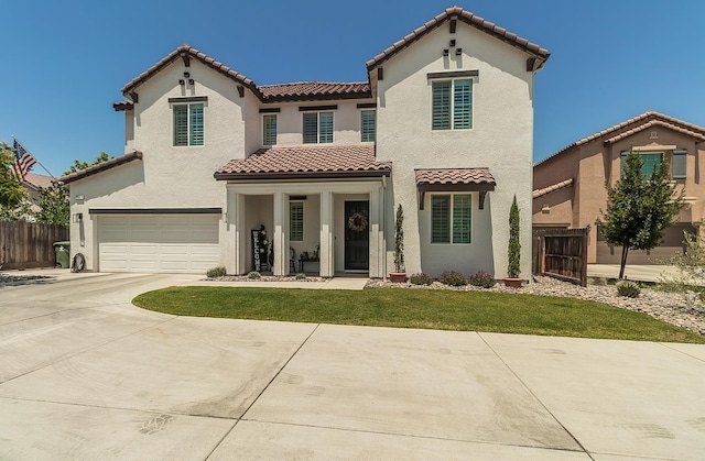2047 Menlo Ave, Clovis, CA 93611 - mediterranean / spanish-style home with a tile roof, a garage, concrete driveway, and stucco siding