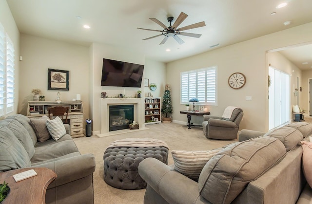 2047 Menlo Ave, Clovis, CA 93611 - living area featuring ceiling fan, carpet floors, a glass covered fireplace, and recessed lighting