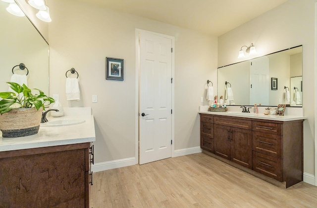 2047 Menlo Ave, Clovis, CA 93611 - bathroom featuring wood finished floors and two vanities