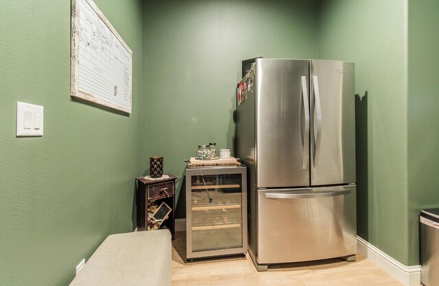2047 Menlo Ave, Clovis, CA 93611 - kitchen featuring freestanding refrigerator, beverage cooler, and light wood-style flooring