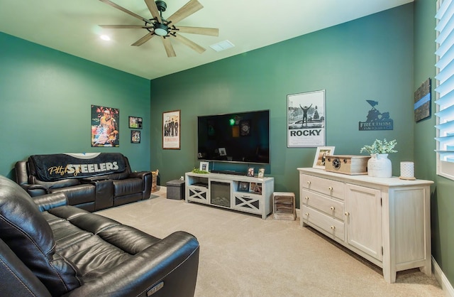 2047 Menlo Ave, Clovis, CA 93611 - living area featuring light carpet, ceiling fan, and plenty of natural light