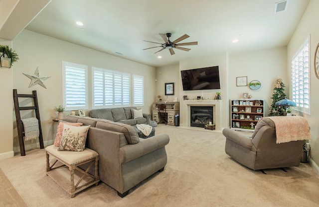 2047 Menlo Ave, Clovis, CA 93611 - living area with ceiling fan, plenty of natural light, carpet flooring, a glass covered fireplace, and recessed lighting